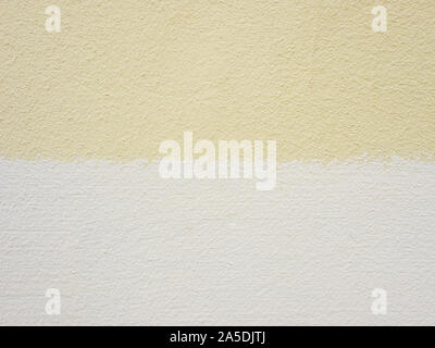 Yellow and beige painted cement wall. Abstract grunge texture background. Copy space, empty template for text Stock Photo