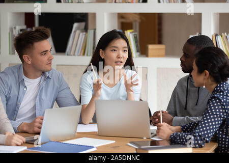 Multiracial students working on common project thinking studying together Stock Photo