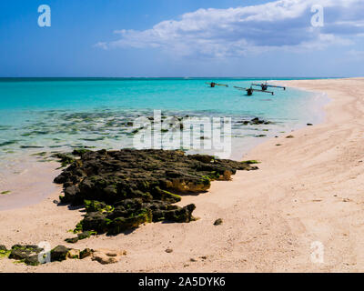 Picturesque fishermen pirogues moored on white sand beach, Nosy Ve island, Indian Ocean, Madagascar Stock Photo