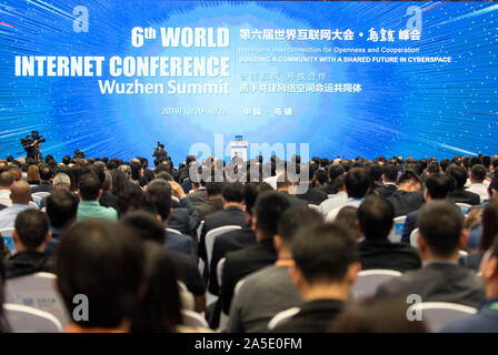 (191020) -- TONGXIANG, Oct. 20, 2019 (Xinhua) -- People attend the opening ceremony of the sixth World Internet Conference in Wuzhen, east China's Zhejiang Province, Oct. 20, 2019. The sixth World Internet Conference opened Sunday in Wuzhen. With the theme of 'Intelligent Interconnection for Openness and Cooperation -- Building a Community with a Shared Future in Cyberspace,' the three-day conference will bring together more than 1,500 participants from over 80 countries and regions, including members of the Internet Hall of Fame, Nobel Prize winners and Turing Award winners. (Xinhua/Zhang Xia Stock Photo