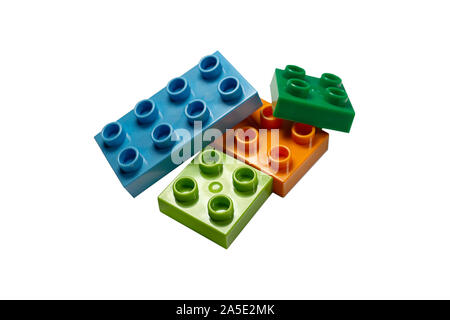 Plastic colorful building blocks, isolated on white. Stock Photo