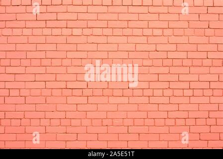 Pink or salmon color painted brick wall. Stock Photo