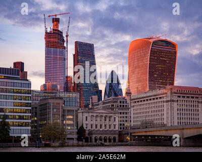 20 Fenchurch street building (the Walkie-Talkie), Gherkin and cheese grater buildings at sunset, London, UK. Stock Photo