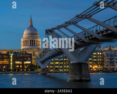 St Paul's Cathedral and Millennium Bridge  over River Thames at dusk, London, UK. Stock Photo