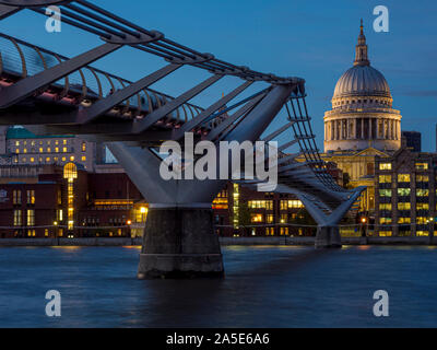 St Paul's Cathedral and Millennium Bridge over River Thames at dusk, London, UK. Stock Photo