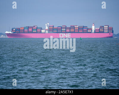 Sheerness, Kent, UK. 20th October, 2019. UK Weather: a cold afternoon in Sheerness, Kent. Pictured: the distinctive 365m long purple hulled container ship 'ONE Minato'. The ONE shipping company decided to paint all newly launched ships in eye-catching magenta, inspired by the cherry blossoms common in Japan, where its three parent companies are located. Credit: James Bell/Alamy Live News Stock Photo