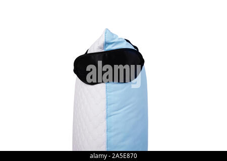 Personofied blue quilted pillow with sleeping mask isolated on white background. Soft cushion for comfortable sleep and sweet dreaming Stock Photo