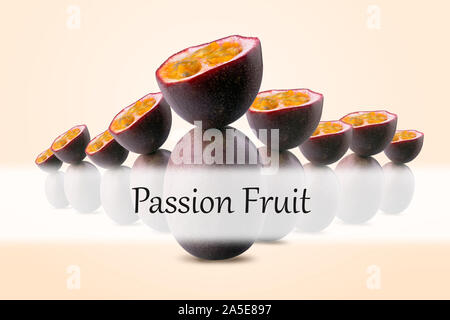 group of half sliced passion fruits balancing on whole passion fruits with "Passion Fruit" inscription on peach background Stock Photo