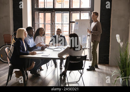 Multiethnic business team having discussion during corporate presentation Stock Photo
