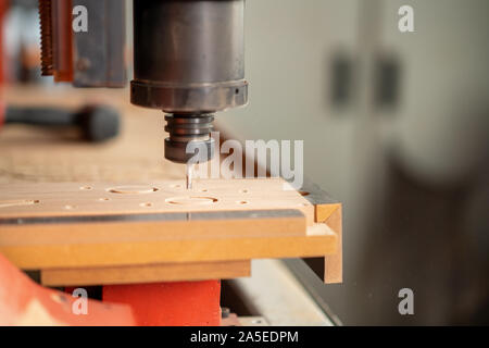 CNC Lathe machine working on wood to lathe and shaping. Stock Photo