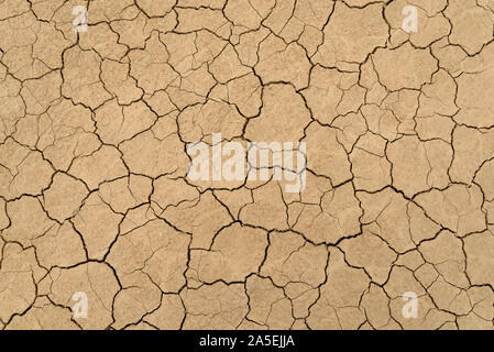 Clay sandy earth parched and cracked Stock Photo