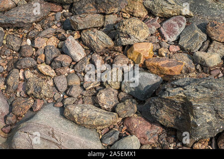 Background of stones in the beach, orange color Stock Photo