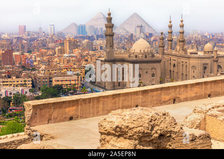 Cairo view, the Mosque-Madrassa of Sultan Hassan and the Pyramids, Egypt Stock Photo