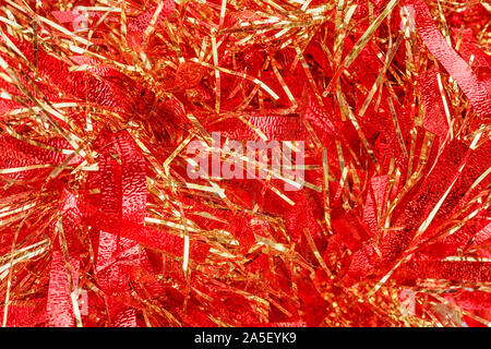 Red Christmas tinsel close up. Texture and background Stock Photo