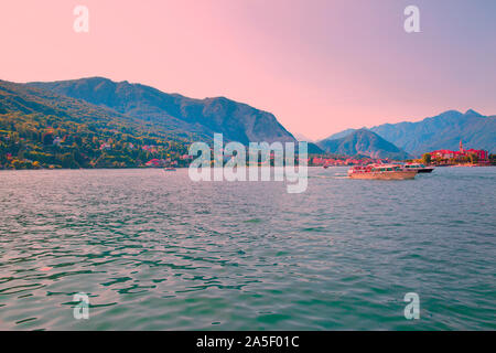 Beautiful sunsen on lake Maggiore in Italy. Pink purple sky. Stock Photo