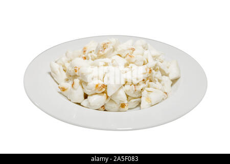 Top view of pile of fresh steamed crab meat without shell and ready to eat on white dish isolated on white background. Stock Photo
