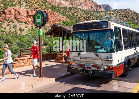 Springdale, USA - August 6, 2019: Zion National Park cliffs at shuttle bus in summer with people waiting to board in Utah at visitor center stop 3 Stock Photo