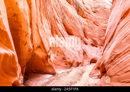 Pink red wave shape formations at Antelope slot canyon in Arizona with footpath trail from Lake Powell Stock Photo