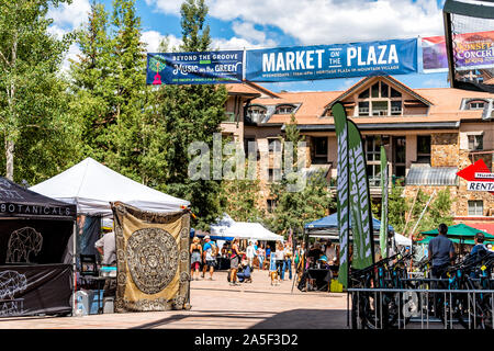 Telluride, USA - August 14, 2019: Small town Mountain Village in Colorado with sign on street heritage plaza for Wednesday farmer's market and people Stock Photo
