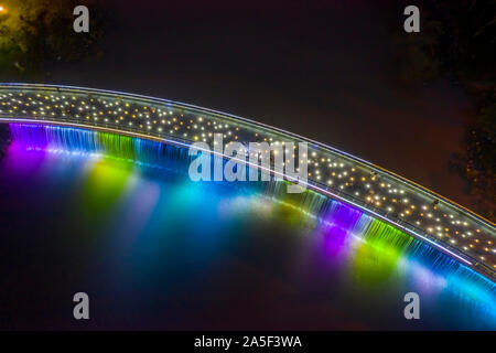 Anh Sao or Starlight Bridge is a pedestrian bridge with  waterfall and beautiful colored lighting on the Saigon River. It is a tourist attraction Stock Photo