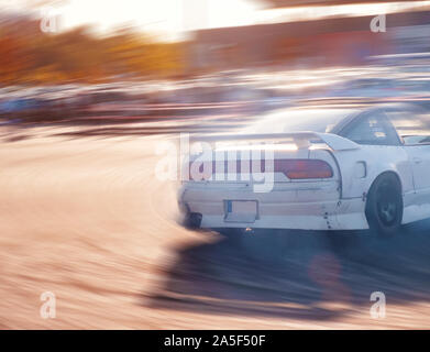 Premium AI Image  Car drifting Blurred image diffusion race drift car with  lots of smoke from burning tires on track