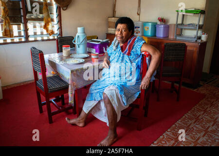 Old Woman inside a house in Solevu island and Yaro island in Malolo Island Mamanucas island group Fiji Stock Photo