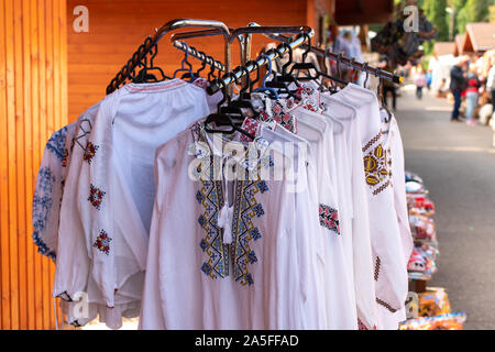 Bucovina, Romania, 15 September 2019 - Romanian souvenirs. Traditional clothing and accessories inside Romanian showroom souvenir shop in Bucovina Stock Photo