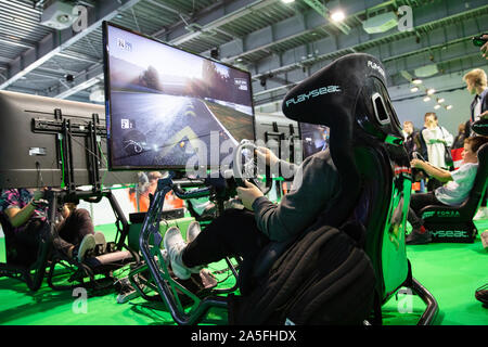 POZNAN, POLAND - October, 18th 2019: People are playing the racing simulator at the PGA2019. PGA2019 is a computer games and entertainment event organ Stock Photo