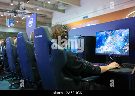 POZNAN, POLAND - October, 18th 2019: People are playing League of Legends at PGA2019. PGA2019 is a computer games and entertainment event organized in Stock Photo