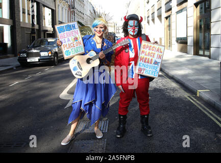London, UK. 19th Oct 2019. A lady who has been called 'EU Supergirl' and her friend Union Jack devil, were part of hundreds of thousands of people demonstrate en route to Parliament in a 'People's Vote - Final Say' march. The House of Commons is sitting, for the first time in 37 yards, on a Saturday to discuss the new Brexit deal. People's Vote - Final Say march, London, UK on October 19, 2019. Credit: Paul Marriott/Alamy Live News Stock Photo