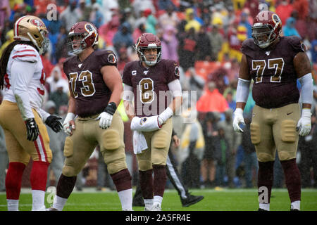 Washington Redskins quarterback Case Keenum (8) looks over the San Francisco 49ers defense in first quarter action at FedEx Field in Landover, Maryland on Sunday, October 20, 2018. Also pictured are Washington Redskins center Chase Roullier (73) and offensive tackle Ereck Flowers, Sr. (77). The 49ers won the game 9 - 0.Credit: Ron Sachs/CNP | usage worldwide Stock Photo