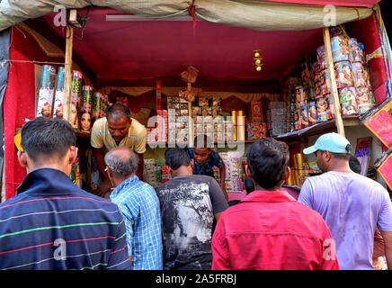 Champahati, India. 20th Oct, 2019. Customers purchase firecrackers from a shop in Champahati.Champahati is the Largest Fireworks market in West Bengal, India from where Millions of Fireworks get supplied all over India for celebration. The market produced Turnover (Rs in Million's), 425 million/ year as per Government's Small scale industries data. Credit: Avishek Das/SOPA Images/ZUMA Wire/Alamy Live News Stock Photo