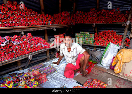 Champahati, India. 20th Oct, 2019. A trader waits for customer in his fire cracker shop in Champahati.Champahati is the Largest Fireworks market in West Bengal, India from where Millions of Fireworks get supplied all over India for celebration. The market produced Turnover (Rs in Million's), 425 million/ year as per Government's Small scale industries data. Credit: Avishek Das/SOPA Images/ZUMA Wire/Alamy Live News Stock Photo