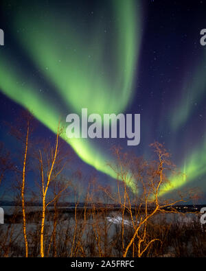 Northern Lights over rural landscape, Abisko National Park, Swedish Lapland, Kiruna, Sweden Stock Photo