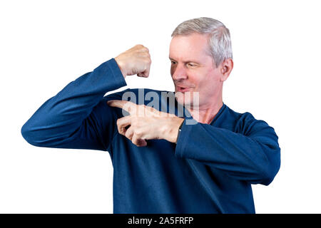 Elderly man shows strength. Isolated on a white background. Stock Photo