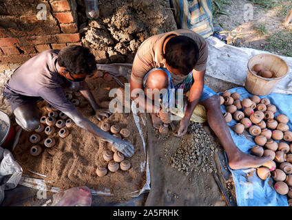 Champahati, India. 20th Oct, 2019. Firework specialists prepare different colourful Fire Crackers which will be used for the upcoming Diwali celebration in India.Champahati is the Largest Fireworks market in West Bengal, India from where Millions of Fireworks get supplied all over India for celebration. The market produced Turnover (Rs in Million's), 425 million/ year as per Government's Small scale industries data. Credit: Avishek Das/SOPA Images/ZUMA Wire/Alamy Live News Stock Photo
