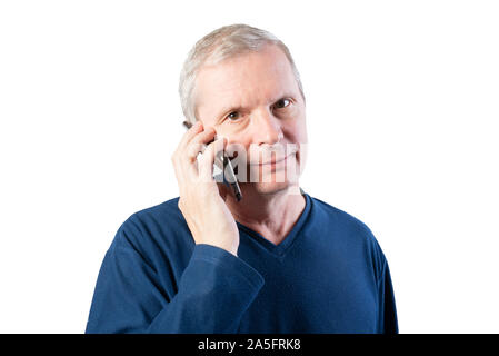 An elderly man talking on a smartphone. Isolated on a white background. Stock Photo