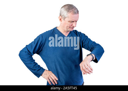 An elderly man measures the pulse of a fitness bracelet. Isolated on a white background. Stock Photo