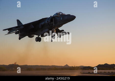A U.S. Marine Corps AV-8B Harrier II Plus aircraft assigned to Marine Aviation Weapons and Tactics Squadron One (MAWTS-1), prepares to land for refueling during Weapons and Tactics Instructor (WTI) course 1-20 at Laguna Army Airfield in Yuma Proving Ground, Arizona, Oct. 7, 2019. WTI is a seven-week training event hosted by MAWTS-1, which emphasizes operational integration of the six functions of Marine Corps aviation in support of a Marine Air Ground Task Force. WTI also provides standardized advanced tactical training and certification of unit instructor qualifications to support Marine avia Stock Photo