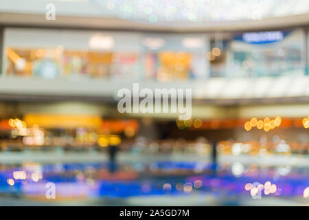 Abstract blurred background of Department store interior cloth fashion zone, concept business fashion and marketing background. Stock Photo