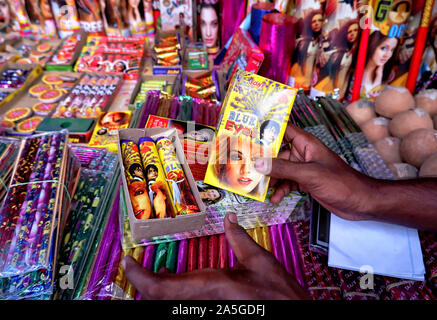 Champahati, India. 20th Oct, 2019. Firecrackers are being displayed by a Trader at a Fire works Market in Champahati approx 30 Km from the main city of Kolkata.Champahati is the Largest Fireworks market in West Bengal, India from where Millions of Fireworks get supplied all over India for celebration. The market produced Turnover (Rs in Million's), 425 million/ year as per Government's Small scale industries data. Credit: SOPA Images Limited/Alamy Live News Stock Photo
