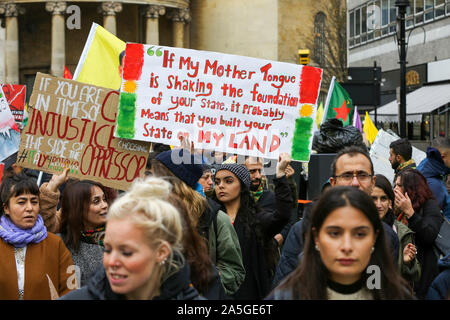 London, UK. 20th Oct, 2019. Kurdish protesters with placards during the demonstration.Protesters are calling for a worldwide mass mobilisation and actions against Turkey's military operation in northern Syria. On 9 October 2019 US President Donald Trump announced that US troops will pull back from the area. Credit: SOPA Images Limited/Alamy Live News Stock Photo