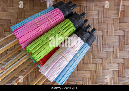 Batch of bamboo paper umbrellas on a mat Stock Photo