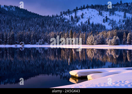 Winter morning sunrise with fresh snow at Donner Lake at Truckee in Sierra Nevada mountains of California, USA. Stock Photo