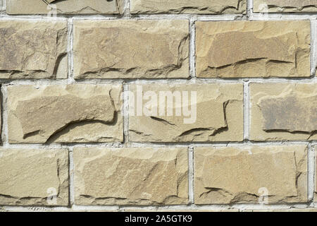 Cladding tiles illuminated by the bright sun close up. Abstract background Stock Photo