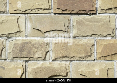 Cladding tiles illuminated by the bright sun close up. Abstract background Stock Photo