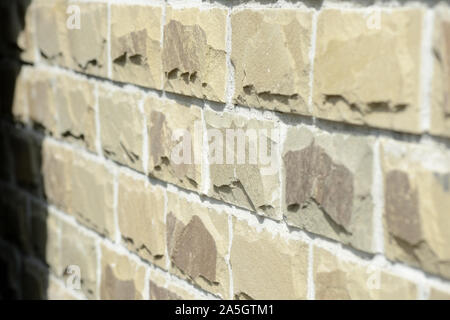 Cladding tiles illuminated by the bright sun close up. Abstract background Stock Photo