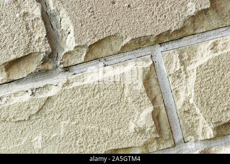 Cladding tiles illuminated by the bright sun close up. Abstract background Stock Photo