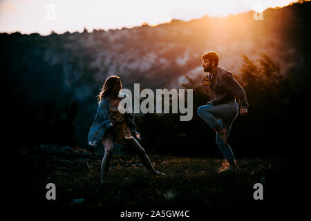 Contemporary dance. Man and woman in passionate dance pose in park. Young couple dancing modern dance Stock Photo