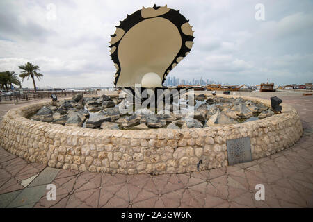 Pearl fountain and skyline of Doha, Qatar, during sunset Stock Photo
